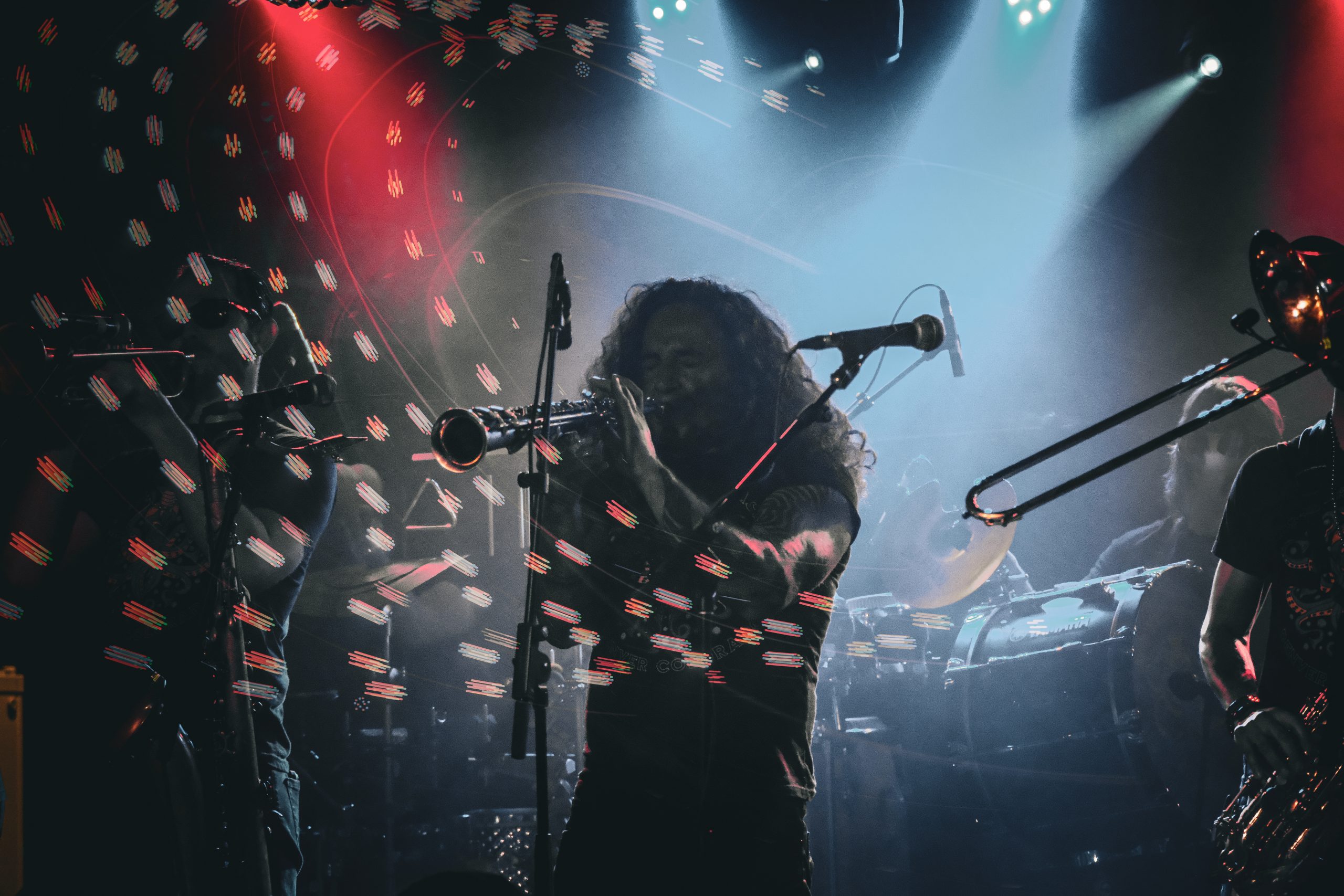 Brothers of Brass saxophone performance with stage-light trails